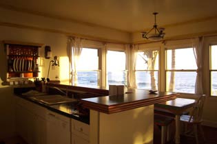 Kitchen Area with gas range and dishwasher. 